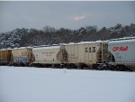 HOPPER CARS SIT IN THE SNOW